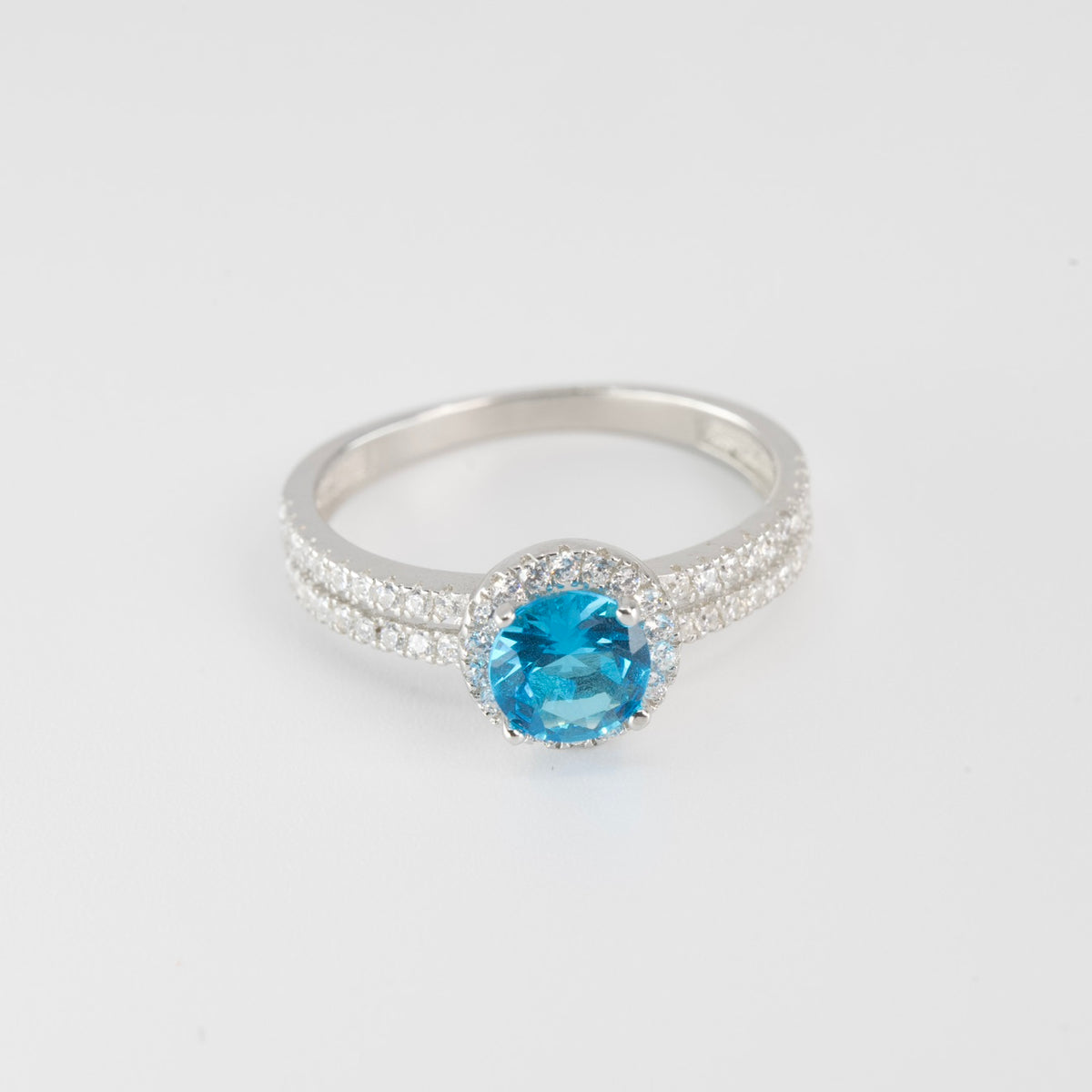 Silver Halo Ring with Blue Topaz Aqua marine Center and Pavé Accents